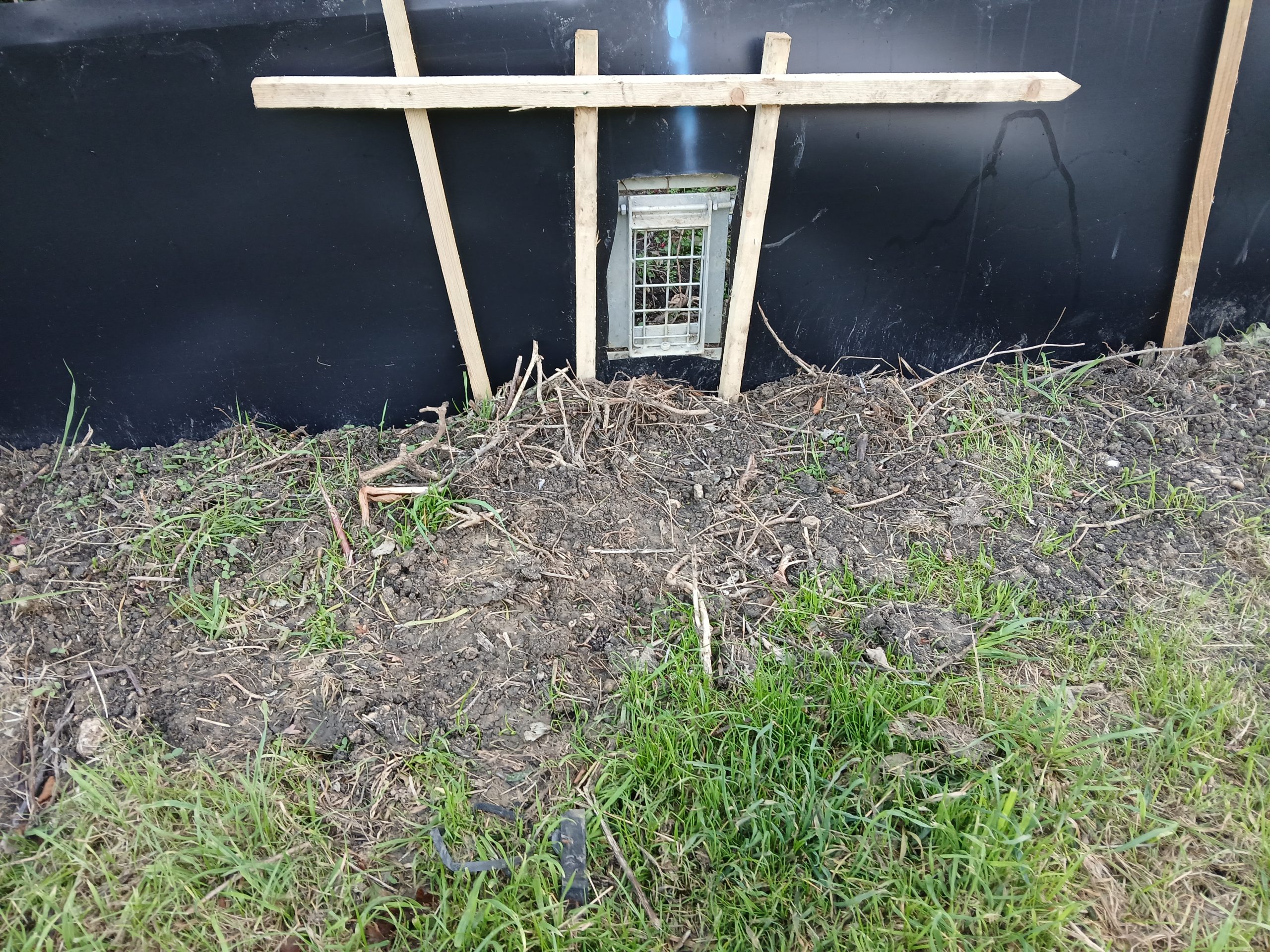 Picture of Badger Gate installed in reptile fence at the Tufa Field